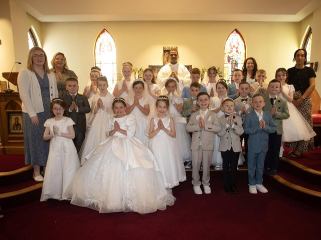 ST. THERESE' FIRST COMMUNION . . . . .Children from St. Therese Primary School, Slievemore who received the Sacrament of First Holy Communion from Fr. Roni Zacharias, CC,at St. Joseph's Church, Galliagh on Friday afternoon. Included are teachers and classroom assistants.. (Photo: Jim McCafferty Photography)