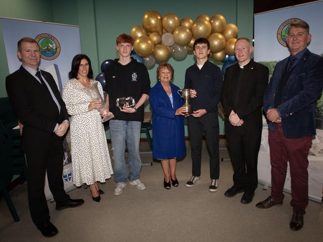 Students Oisin O’Kane, winner of The Health and Social Care Prize and The BTEC National Extended Certificate in Business Prize and Ellis Deery, winner of The Father Seamus McCauley Memorial Prize for Psychology receiving their awards from Mrs. D. Duffy, Year Head and Senior Teacher and Mrs. Marguerite Hamilton, board of governors at last week's awards ceremony. Included from Left are Mr V Doherty, Head of Physics, Fr Séan O’Donnell, School Chaplain and Mr B Keys, Vice Principal. (Photos: Jim McCafferty Photography)