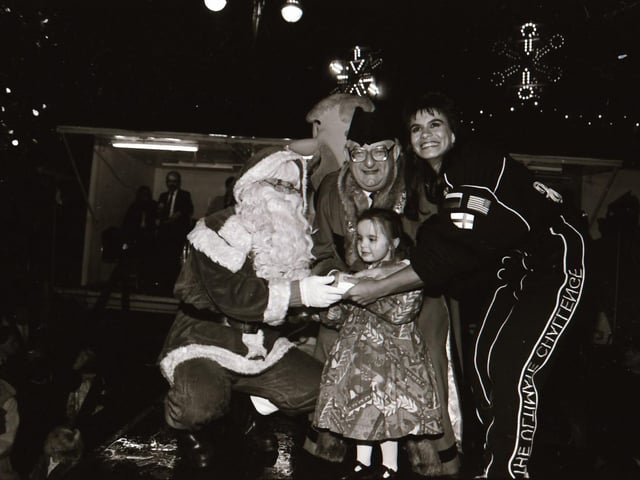 Santa, with help from TV Gladiator Falcon, also known as Bernadette Hunt, switched on the Derry Christmas lights.