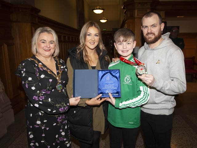 The Mayor of Derry City and Strabane District Council, Sandra Duffy pictured with Strabane teenager Lucas O’Connell and his parents mum Kerry and dad Eathan at Tuesday night’s reception in his honour at the Guildhall, Derry.