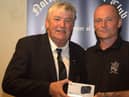 Mr. Sean McLaughlin (Poet) presents his North West Golf Club President' Prize to winner Ciaran Quigley (right).