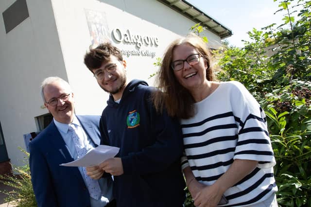 Mr. John Harkin, Principal congratulates Kerem Eryigit on his A Level results at Oakgrove Integrated College on Thursday morning. On right is proud mum Naomi.