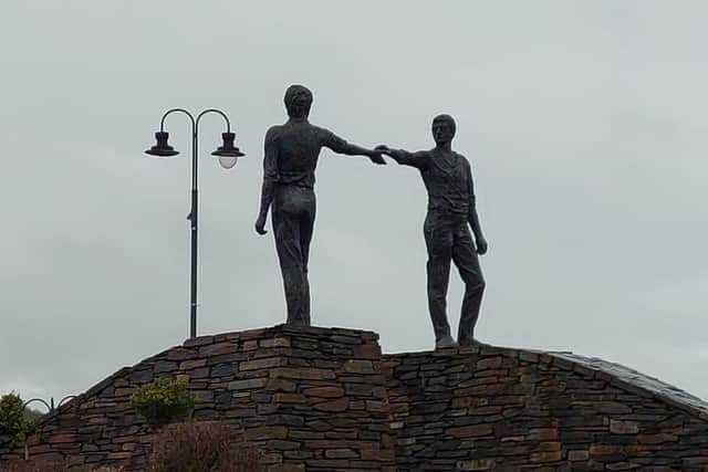 The Hands Across The Divide statue by Maurice Harron.