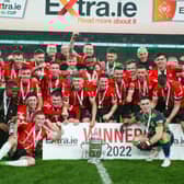 Derry City players celebrate with the FAI Cup at the Aviva Stadium.
