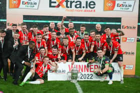 Derry City players celebrate with the FAI Cup at the Aviva Stadium.