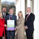 Minister Gordon Lyons marked the announcement of the Housing Supply Strategy at Stormont with co-signatories Seamus Leheny (Northern Ireland Federation of Housing Association), Nicola McCrudden (Homeless Connect), Justin Cartwright (Chartered Institute of Housing Northern Ireland), Grainia Long (The Northern Ireland Housing Executive), and Mark Spence (Construction Employers Federation).