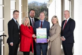Minister Gordon Lyons marked the announcement of the Housing Supply Strategy at Stormont with co-signatories Seamus Leheny (Northern Ireland Federation of Housing Association), Nicola McCrudden (Homeless Connect), Justin Cartwright (Chartered Institute of Housing Northern Ireland), Grainia Long (The Northern Ireland Housing Executive), and Mark Spence (Construction Employers Federation).