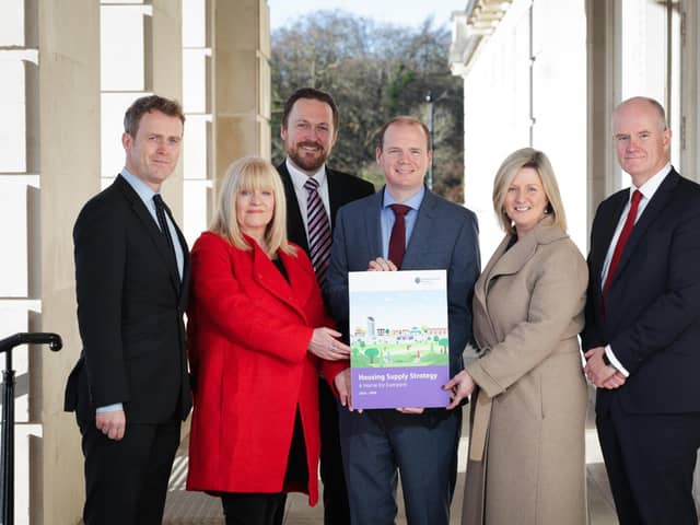 Minister Gordon Lyons marked the announcement of the Housing Supply Strategy at Stormont with co-signatories Seamus Leheny (Northern Ireland Federation of Housing Association), Nicola McCrudden (Homeless Connect), Justin Cartwright (Chartered Institute of Housing Northern Ireland), Grainia Long (The Northern Ireland Housing Executive), and Mark Spence (Construction Employers Federation).
