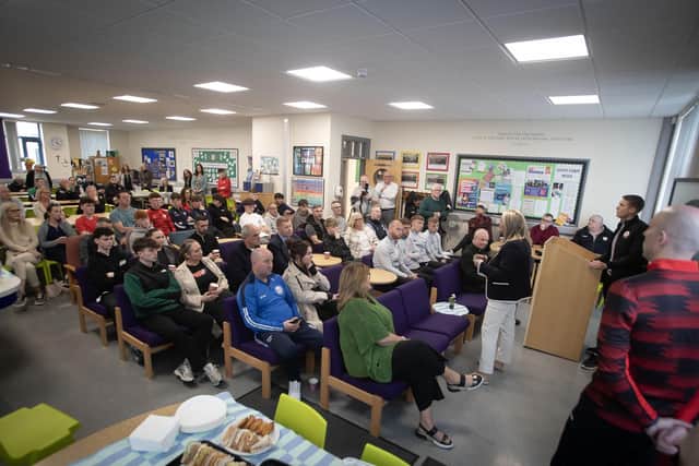 CREATING CAREERS IN FOOTBALL. . . . St. Joseph's Boys School Prncipal, Mrs. Ciara Deane addressing the attendance at Monday's launch of the Derry City Football Academy at the Creggan school. (Photos: Jim McCafferty Photography)