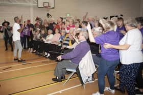 Entertainer Micky Doherty leads the sing-song at Wednesday’s DEEDS Halloween Tea Party. 