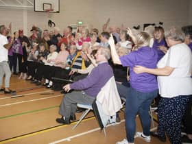 Entertainer Micky Doherty leads the sing-song at Wednesday’s DEEDS Halloween Tea Party. 