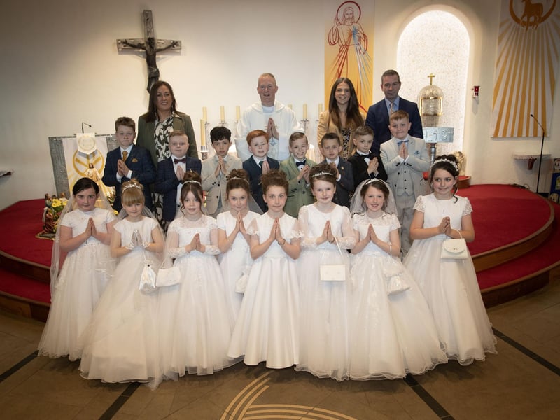 Pupils from Mrs. Cunningham's class at Greenhaw Primary School who received the Sacrament of First Holy Communion from Fr. Sean O'Donnell at St. Brigid's Church, Carnhill on Friday last. Included are Miss Coyle, teaching assistant and Mr. Sean McLaughlin, Principal. (Photo: Jim McCafferty Photography)