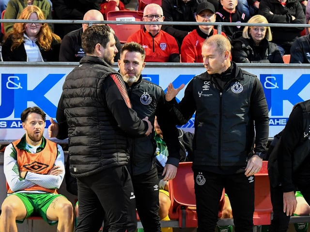 Ruaidhri Higgins greets Shamrock Rovers manager Stephen Bradley and coach Glenn Cronin. Photograph: George Sweeney