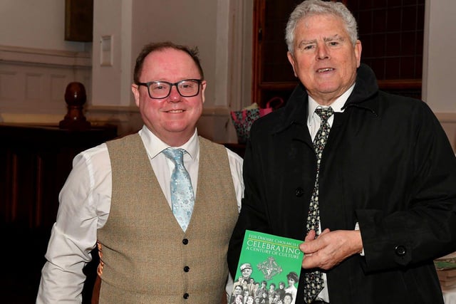 Eamon Sweeney author of ‘Feis Dhoire Cholmcille: Celebrating a Century of Culture’ pictured Feis Secretary Pat McCafferty at the book launch held in St Columb’s Hall on Tuesday evening. Photo: George Sweeney. DER2308GS – 74
