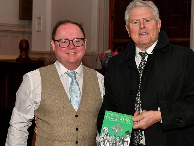 Eamon Sweeney author of ‘Feis Dhoire Cholmcille: Celebrating a Century of Culture’ pictured Feis Secretary Pat McCafferty at the book launch held in St Columb’s Hall on Tuesday evening. Photo: George Sweeney. DER2308GS – 74