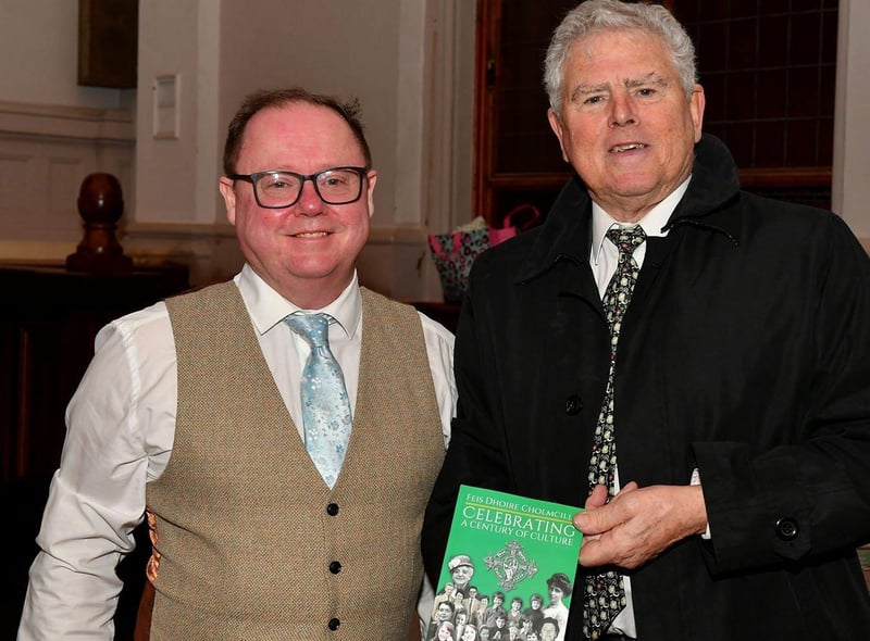 Eamon Sweeney author of ‘Feis Dhoire Cholmcille: Celebrating a Century of Culture’ pictured Feis Secretary Pat McCafferty at the book launch held in St Columb’s Hall on Tuesday evening. Photo: George Sweeney. DER2308GS – 74