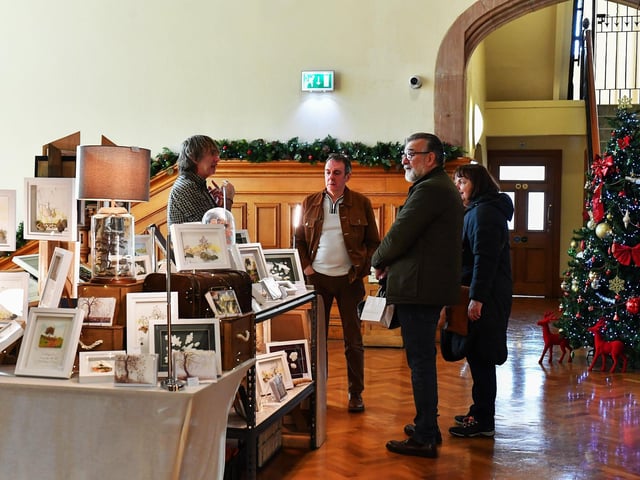 People browse the large range of gifts at the Guildhall Christmas Fair on Friday afternoon. Photo: George Sweeney / Derry Journal