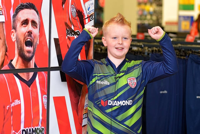 Bobby McCormack, aged 8, records a good luck video message for the Derry City team at O’Neill’s Sports store ahead of their Extra.ie FAI Cup final against Shelbourne.  DER2244GS – 108