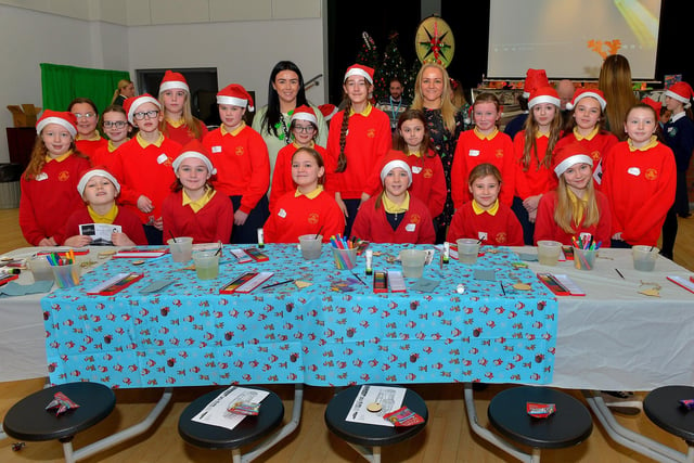 Pupils from Steelstown Primary School pictured with Miss McLaughlin and Mrs McGlinchey at the St Cecilia’s College Christmas Workshop on Friday morning.  Photo: George Sweeney. DER2248GS – 89