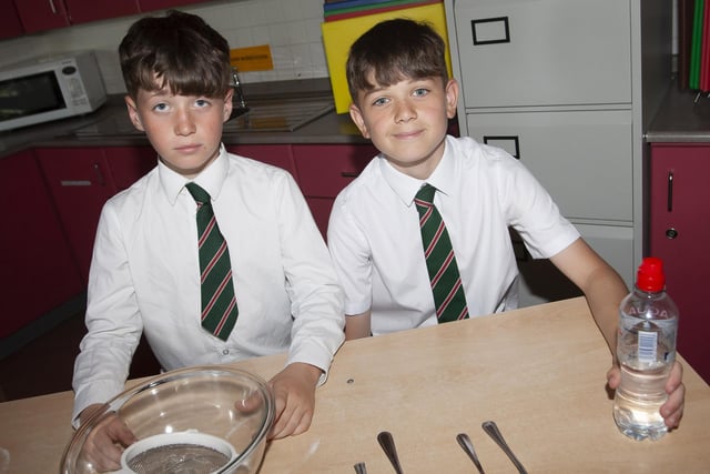 Greenhaw PS P7 pupils Shea Sweeney and Kian Gibbons get ready to bake some buns at the St. Joseph’s  Boys School Induction Day on Tuesday last. (Photos: Jim McCafferty Photography)