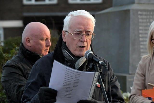 John Kelly reads the names of the murdered and wounded at the Bloody Sunday monument, at Joseph’s Place on Tuesday afternoon, where a one minute silence was observed on the 52nd anniversary of the Bloody Sunday massacre. Photo: George Sweeney.