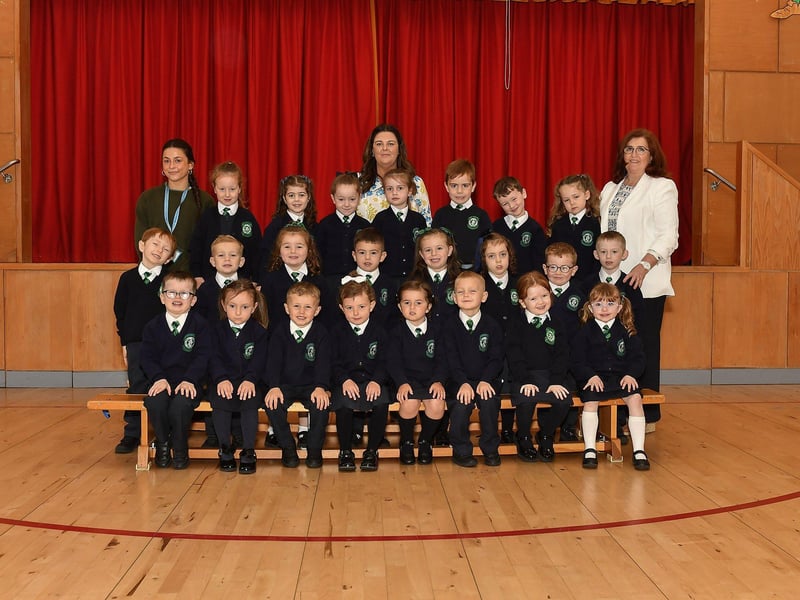 Mrs Dooley (centre) teacher and Miss O’Neill and Miss McGowan classroom assistants pictured with P1 pupils at St Patrick’s Primary School.