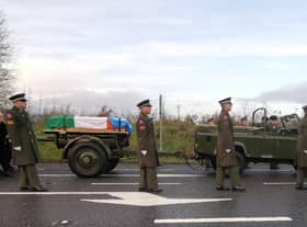 Members of the Irish Defence Forces lead Pte Rooney's funeral cortege to the cemetery at All Saints Church, Newtowncunningham.