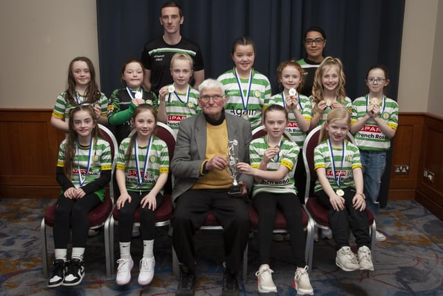 John ‘Jobby’ Crossan pictured with the Top of the Hill Girls U9 team, winners of the Winter Cup, during the Annual Awards in the City Hotel on Friday night last. Included are coaches Ciaran McCloskey and Caoili Bradley.