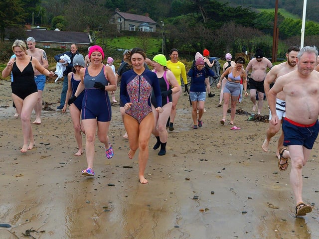 People taking part in the annual ARC Fitness New Year's Day Charity Swim at Lisfannon beach make their way into the Swilly.  Photo: George Sweeney. DER2301GS  02
