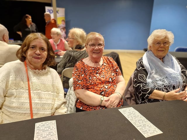 Bernadette Lynch, Bridie McCallion and Lily Gallagher prepare for a game of bingo at the event held in the Gasyard Centre