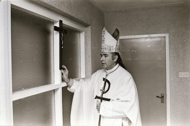 Reverend Dr Edward Daly, Bishop of Derry, blessing the school during its official opening in 1975.