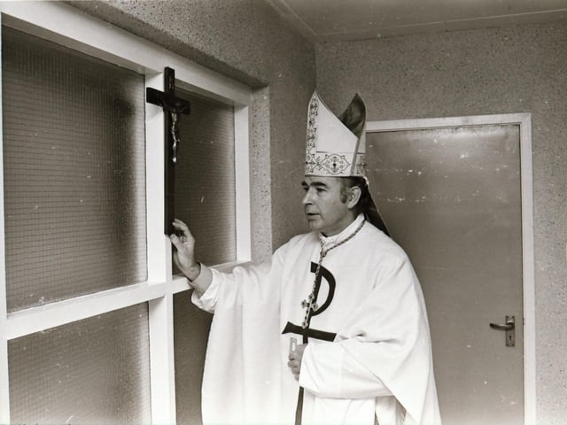 Reverend Dr Edward Daly, Bishop of Derry, blessing the school during its official opening in 1975.