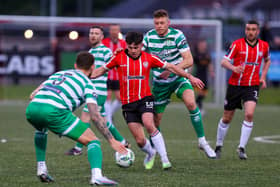 Derry City midfielder Adam O'Reilly jinks past Rovers defender Lee Grace during Monday's clash at Brandywell. Photo by Kevin Moore.