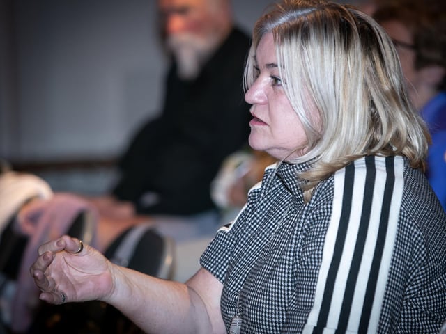 Former Republican activist Anne Walker asks a question at Monday night's lecture.
