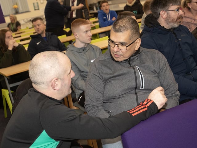 Manchester United Foundation's Stephen Parkhouse speaking with a parent on Thursday night.