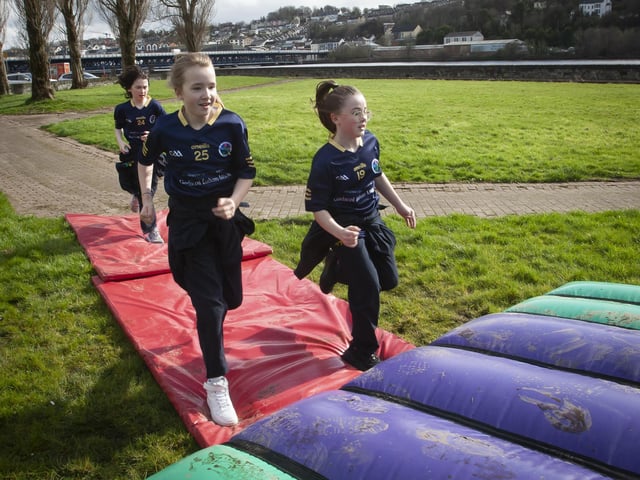 GIRL POWER!. . . . Girls from Gaelscoil Eadain Mhoir make their way through an obstacle during Thursday’s 5k Dash.