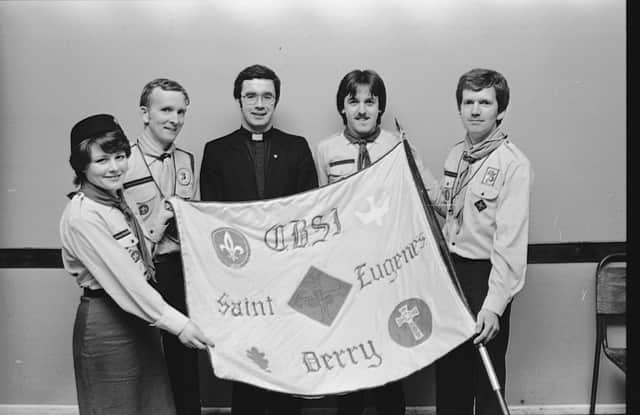 Pictured displaying the first flag of the 4th and 12th (St Eugene's) Derry Unit of the CBSI which was unfurled and blessed by the Unit Chaplain Rev Gerard Convery, C.C., St Eugene's, during the Mass in St Eugene's Cathedral on the occasion of the Unit's 10th anniversary celebrations. From left are Siobhan McGlinchey, Cub Leader, Desmond Taylor, Cub Leader, Fr Convery, Liam Hamilton, Scout Leader and Martin McDaid, Unit Leader.