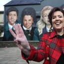 'Derry Girls' creator Lisa McGee beside a mural in honour of the show at Badger's bar next to the Derry Walls.