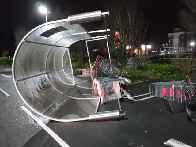 A trolley canopy overturned in Sainsbury's car park during Storm Isha