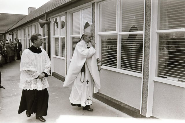 Reverend Dr Edward Daly, Bishop of Derry, blessing the school during its official opening in 1975.