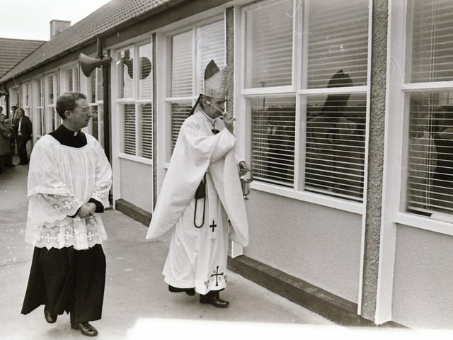 Reverend Dr Edward Daly, Bishop of Derry, blessing the school during its official opening in 1975.