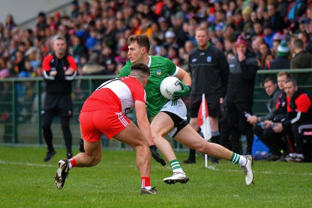 Derry’s Conor Doherty challenges James Naughton of Limerick during their Division Two opener at Owenbeg on Saturday afternoon. Photo: George Sweeney. DER2305GS – 139 