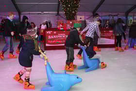 2014: Young skaters at the Legenderry on Ice rink in Ebrington Square. DER 5014-3802MT.