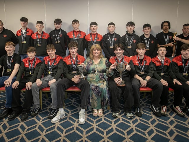 The Deputy Mayor Niree McMorris presenting Phoenix Athletic u-16s with their trophies at the Annual D&D Youth FA awards on Friday night. Included are coaches Stephen Gallagher and Barry Ward.. (Photos: Jim McCafferty Photography)