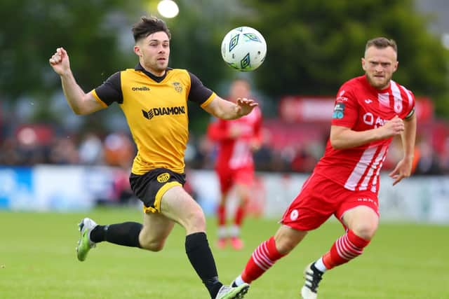 Derry City's Adam O'Reilly gets away from Sligo Rovers captain David Cawley.