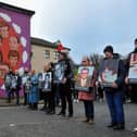 Relatives pass the mural on Westland Street depicting those killed Bloody Sunday. Photo: George Sweeney, DER2205GS – 016