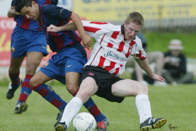 Derry City captain Eamon Doherty and Barcelona forward Saviola battle for possession.  (1508JB14)
