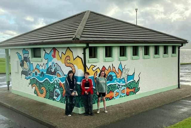 Helpers at the new, revamped toilet block.