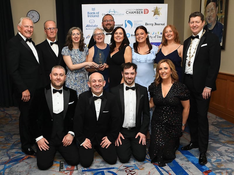 David Ramsey, Energy Advisor at Firmus Energy, pictured with winners of Large Business of The year winners FinTrU.