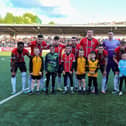 Mascots pictured with Derry City’s starting eleven for the game against Dundalk, at Brandywell Stadium, on Monday evening. Photo: George Sweeney.  DER2320GS – 47  